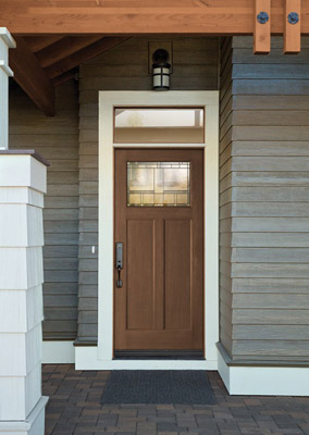 Brown fibreglass front door with small rectangular transom and quarter glass insert