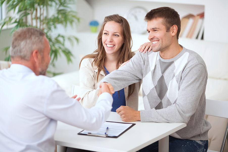 A couple receiving an in-home consultation from Consumer's Choice Windows and Doors.