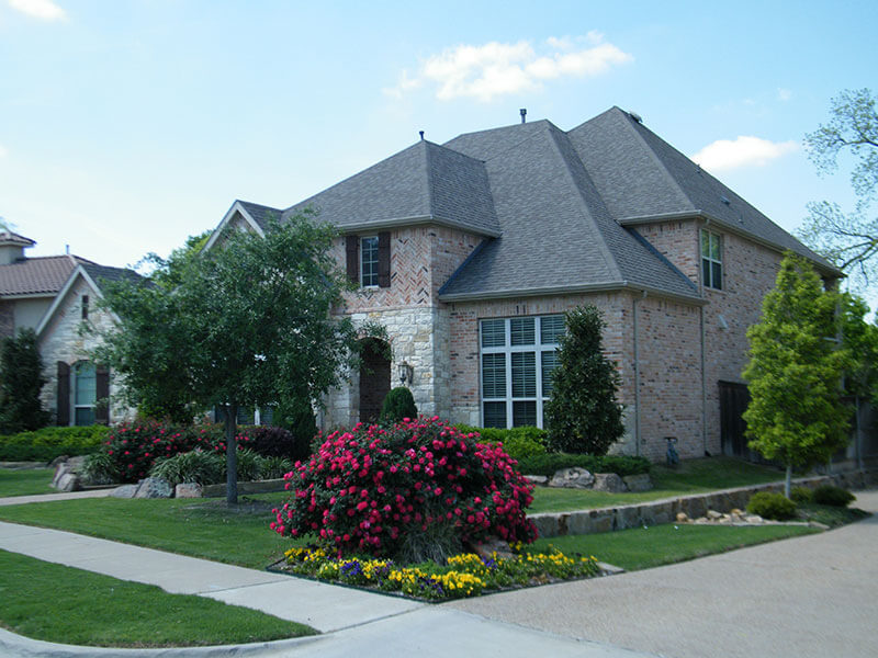 A modern home in suburban Scarborough, Ontario with a large bay window and a modern front entry door.