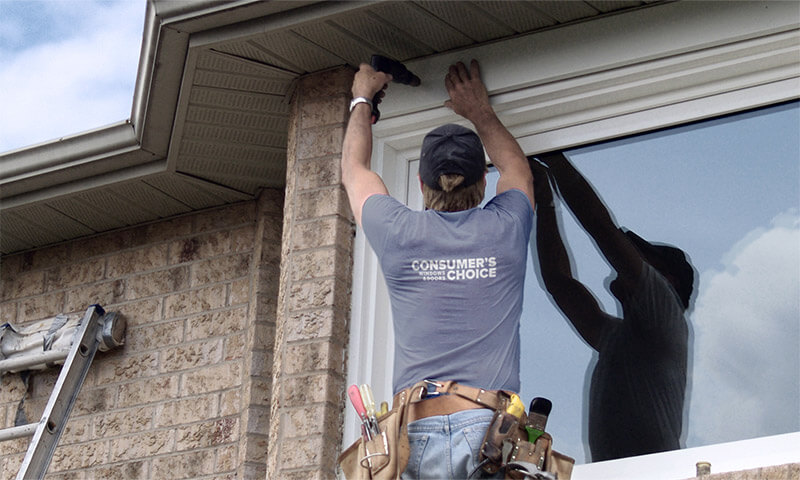 Consumers choice window installer installing a new window on a home.