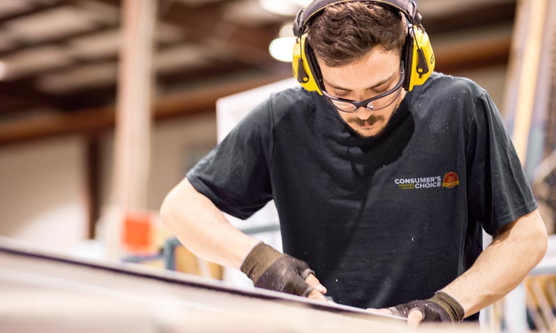 Consumers choice window manufacturer assembling a window.